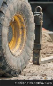 Front wheel of an excavator on the construction site