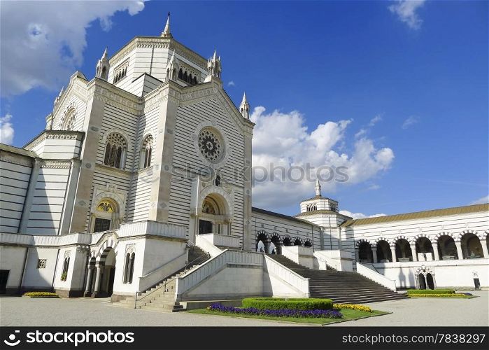 Frontal facade view of Cimitero Monumentale in a beautiful day with blue sky, Monumental Cemetery, Milan, Lombardy, Italy, Europe.
