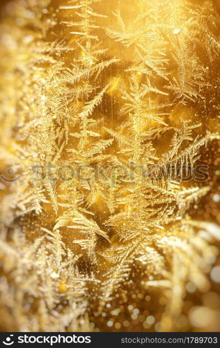 Frost gold Xmas pattern background texture . Macro photo of real snowflakes. Beautiful ornate, structure and elegant shape. Element of design.