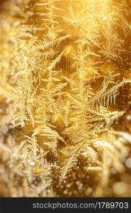 Frost gold Xmas pattern background texture . Macro photo of real snowflakes. Beautiful ornate, structure and elegant shape. Element of design.