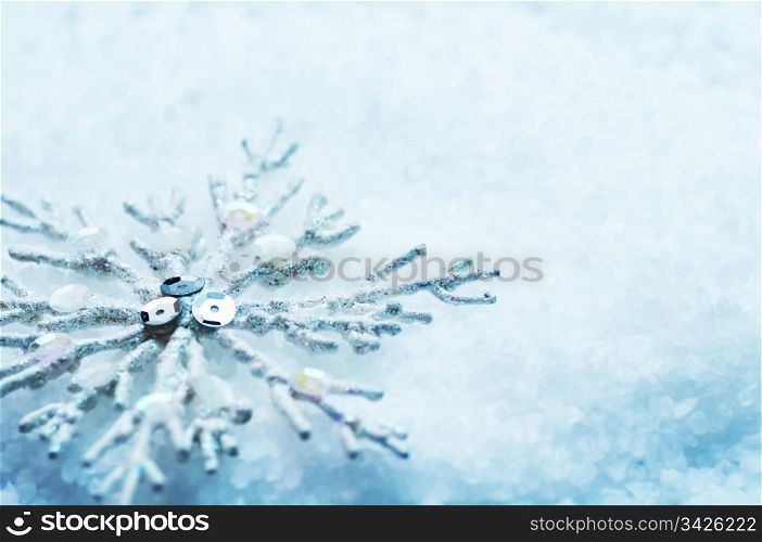 Frosty snowlake in snow Christmas decoration background