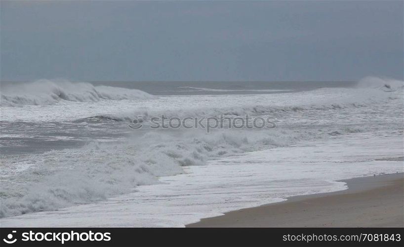 Frothy waves crash onto the shore
