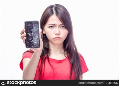 Frowning Chinese woman, OOF, holding cell phone with cracked screen