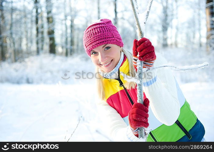 Frozen beautiful woman in winter clothing outdoors