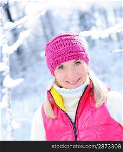 Frozen beautiful woman in winter clothing outdoors