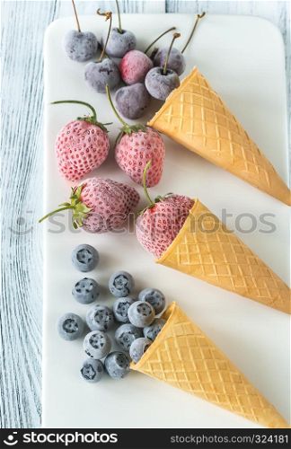 Frozen berries in waffle cones