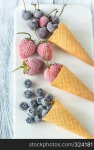 Frozen berries in waffle cones