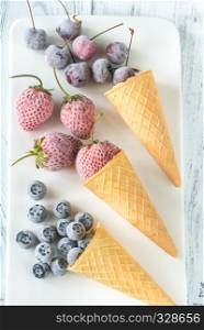 Frozen berries in waffle cones