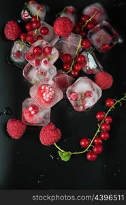 Frozen berries on wooden table. Fresh frozen berries raspberry and red currant