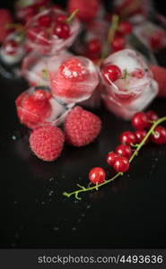 Frozen berries on wooden table. Fresh frozen berries raspberry and red currant