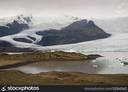 Frozen blue icebergs in a glacial lake