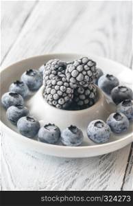 Frozen blueberries and blackberries on the plate