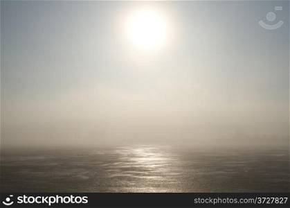 Frozen lake and sunlight in winter