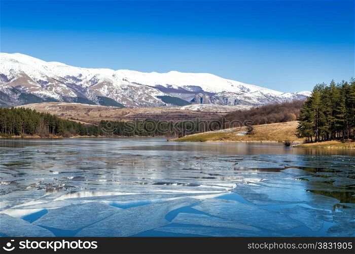 Frozen mountain lake in the winter