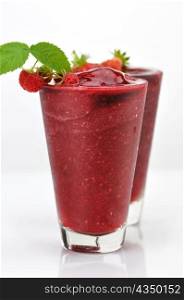 Frozen strawberry and raspberry smoothie with fresh berries