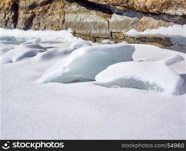 Frozen water covered with snow in Lake Baikal, Russia
