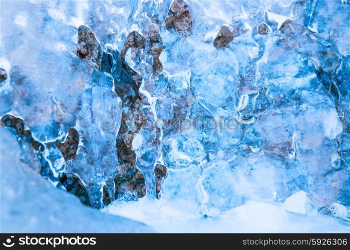 Frozen waterfall in blue ice. Winter background