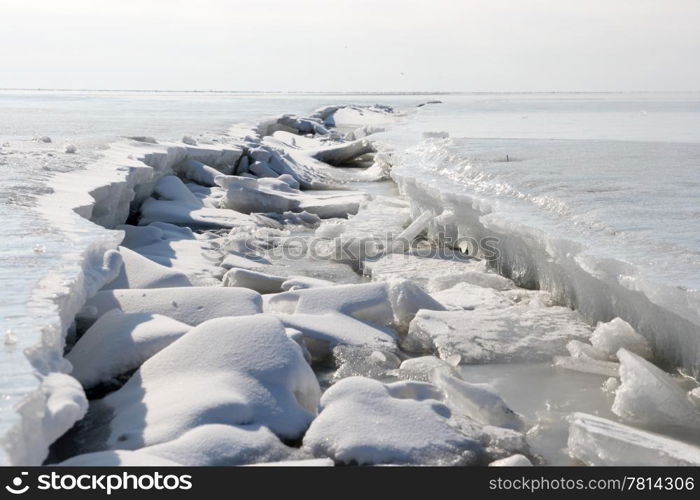 frozen Winter sea, the crack in the ice, background