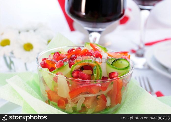 Fruit and vegetable salad with pomegranate seeds and sesame seeds
