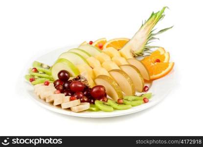 Fruit assortment closeup at plate on a white background