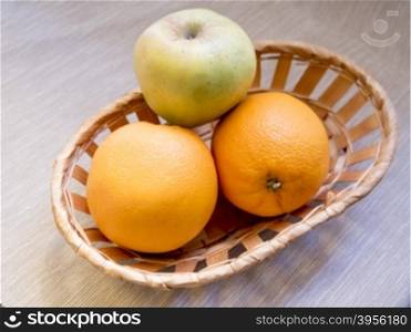 fruit basket on wooden background. Retro processing. fruit basket on wooden background