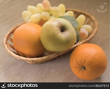 fruit basket on wooden background. Retro processing. fruit basket on wooden background