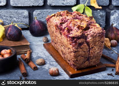 Fruit bread with nuts. Autumn baking. Homemade bread cake with ripe figs and nuts