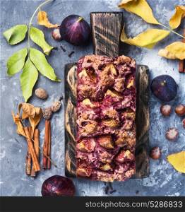Fruit bread with nuts. bread with nuts and figs on an autumn background, with fallen leaves