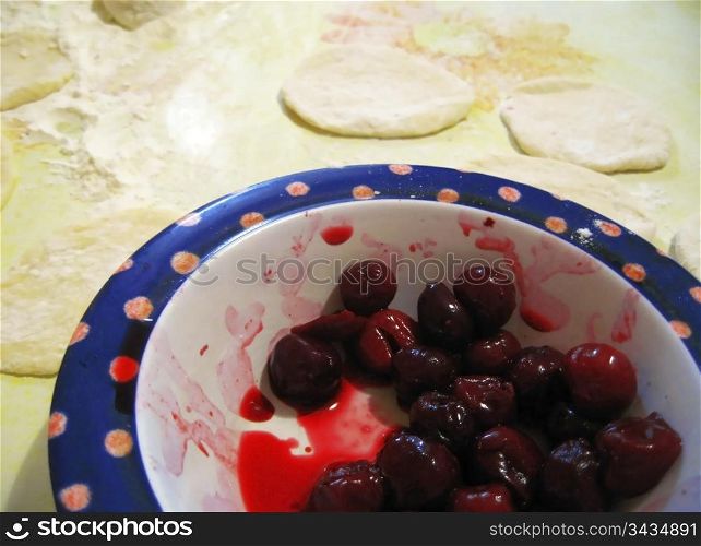 Fruit dampling with cherry. Process of cooking