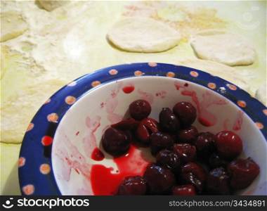 Fruit dampling with cherry. Process of cooking