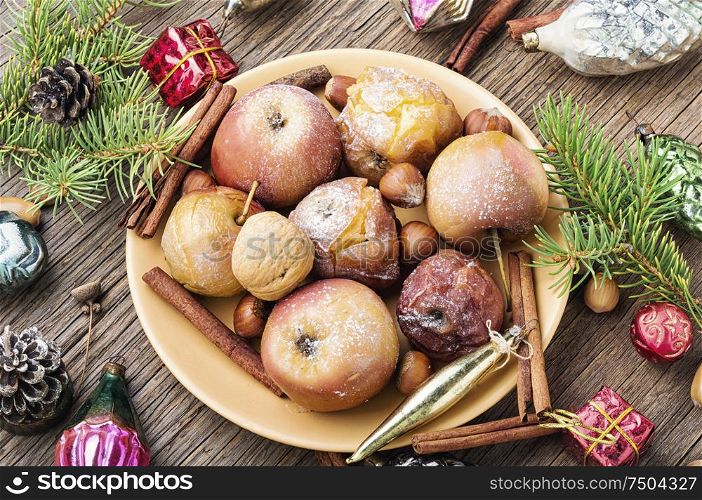 Fruit dessert baked red apples.Christmas food and winter decoration. Winter baked apples
