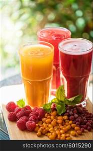 fruit drink with cranberries raspberries and sea buckthorn. set of fruit non-alcoholic drink with cranberries raspberries and sea buckthorn