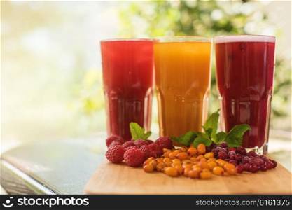 fruit drink with cranberries raspberries and sea buckthorn. set of fruit non-alcoholic drink with cranberries raspberries and sea buckthorn