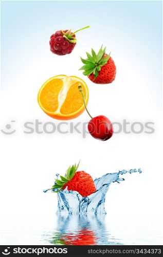 Fruit falling in water on a white background