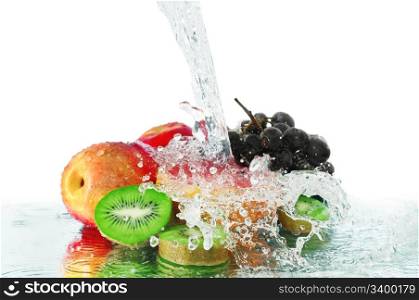 fruit in a spray of water isolated on a white background.
