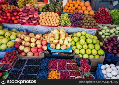 Fruit market with various colorful fresh fruits. Fresh fruits. Fruits at a farmers market