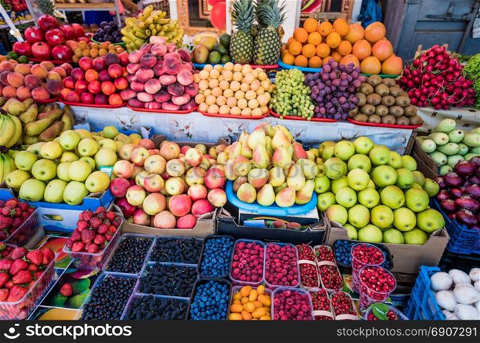 Fruit market with various colorful fresh fruits. Fresh fruits. Fruits at a farmers market