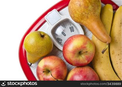fruit on the floor scales isolated on white background