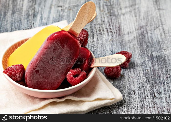 Fruit popsicles ice cream on a plate.