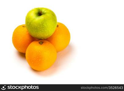 fruit pyramid with water drops on white background