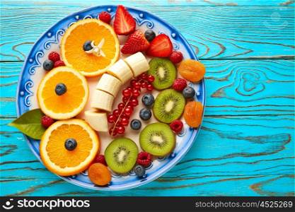 Fruit salad breakfast orange banana kiwi berries ow turquoise table