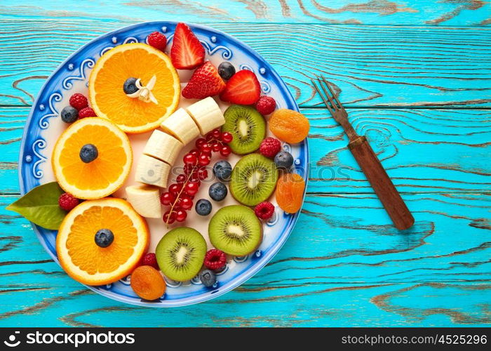 Fruit salad breakfast orange banana kiwi berries ow turquoise table