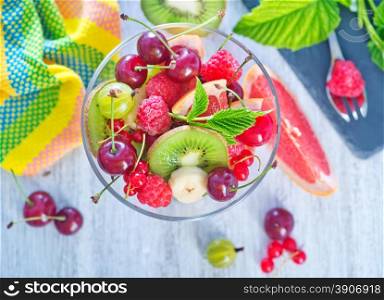 fruit salad in bowl and on a table