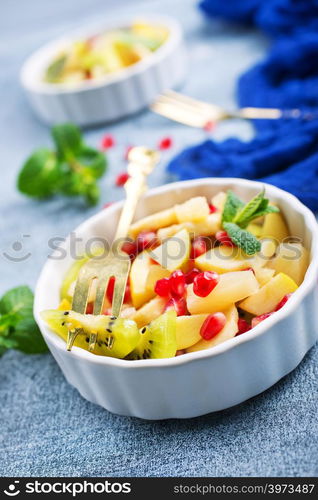 fruit salad in bowl, vitamin salad with mint leaf