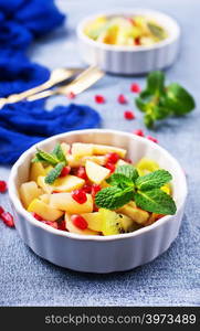 fruit salad in bowl, vitamin salad with mint leaf