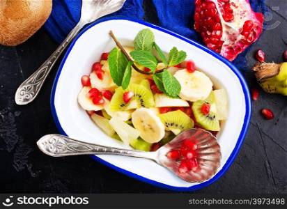 fruit salad in bowl, vitamin salad with mint leaf