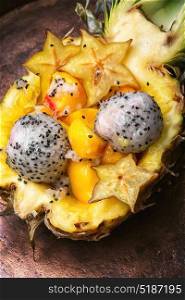Fruit salad in pineapple. Vegetarian food.Exotic fruit salad of tropical fruit in pineapple