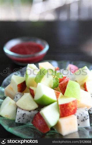 fruit salad on wood background