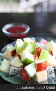fruit salad on wood background