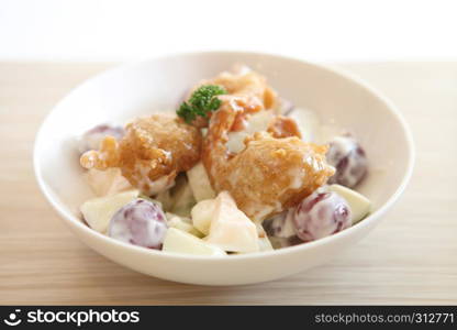 fruit salad on wood background